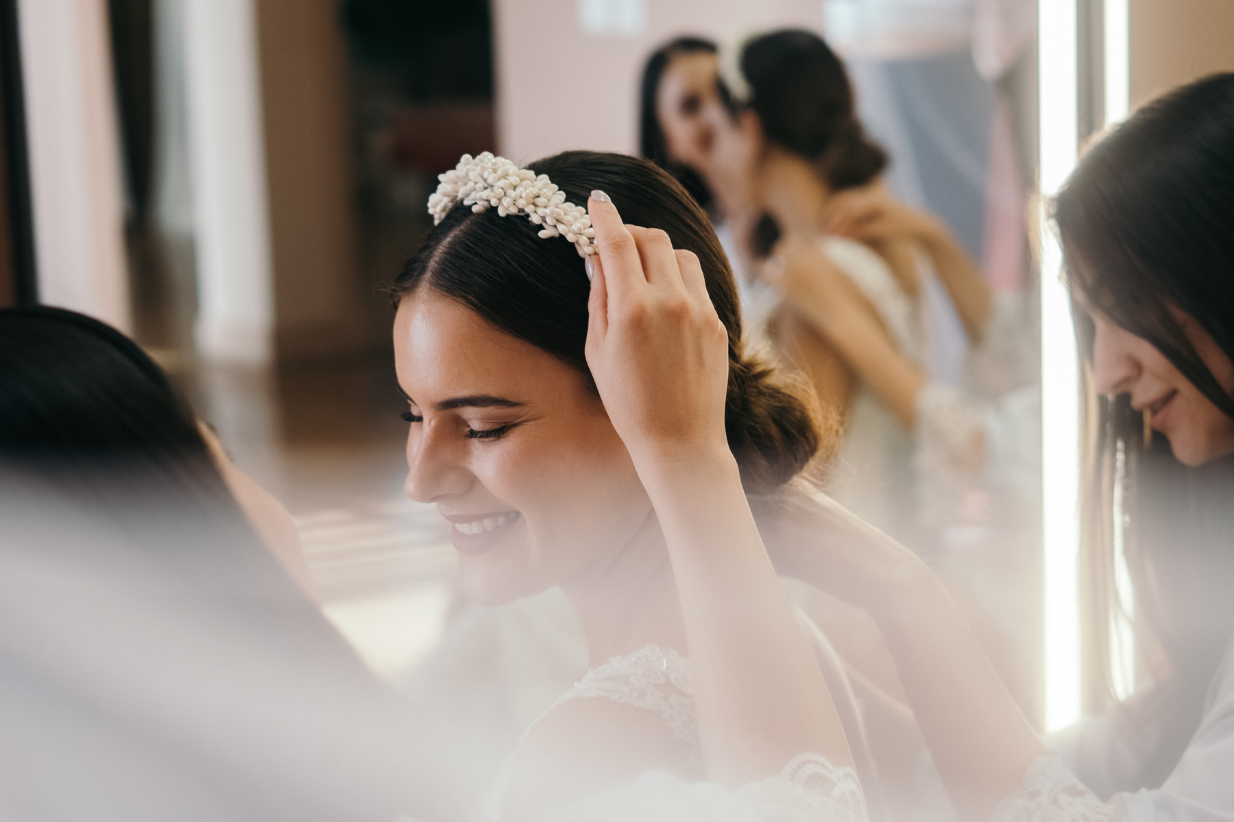 A Woman Putting the Headband to the Bride